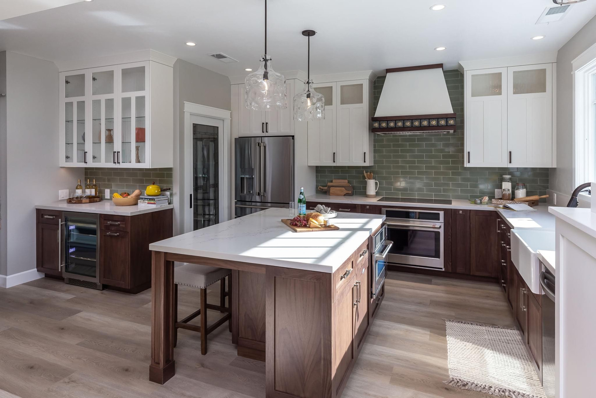 Custom walnut and white shaker kitchen with quartz island