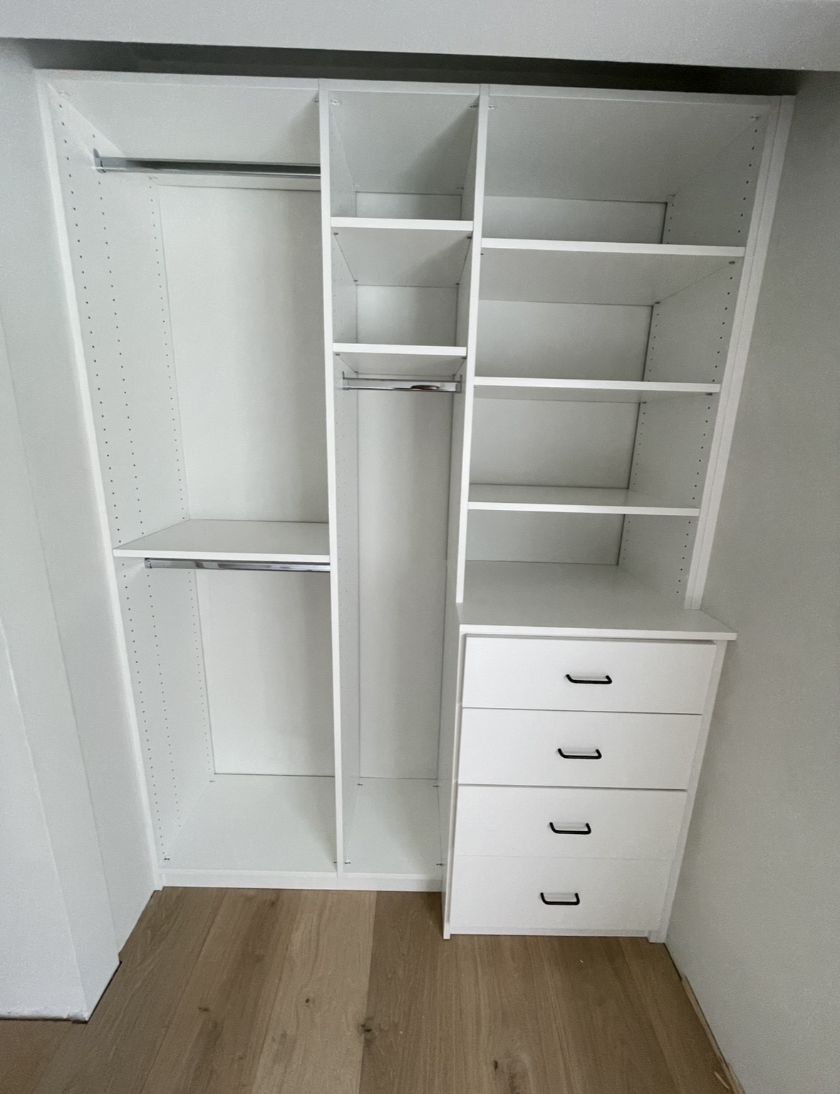 Custom reach-in closet with double hanging and drawer storage