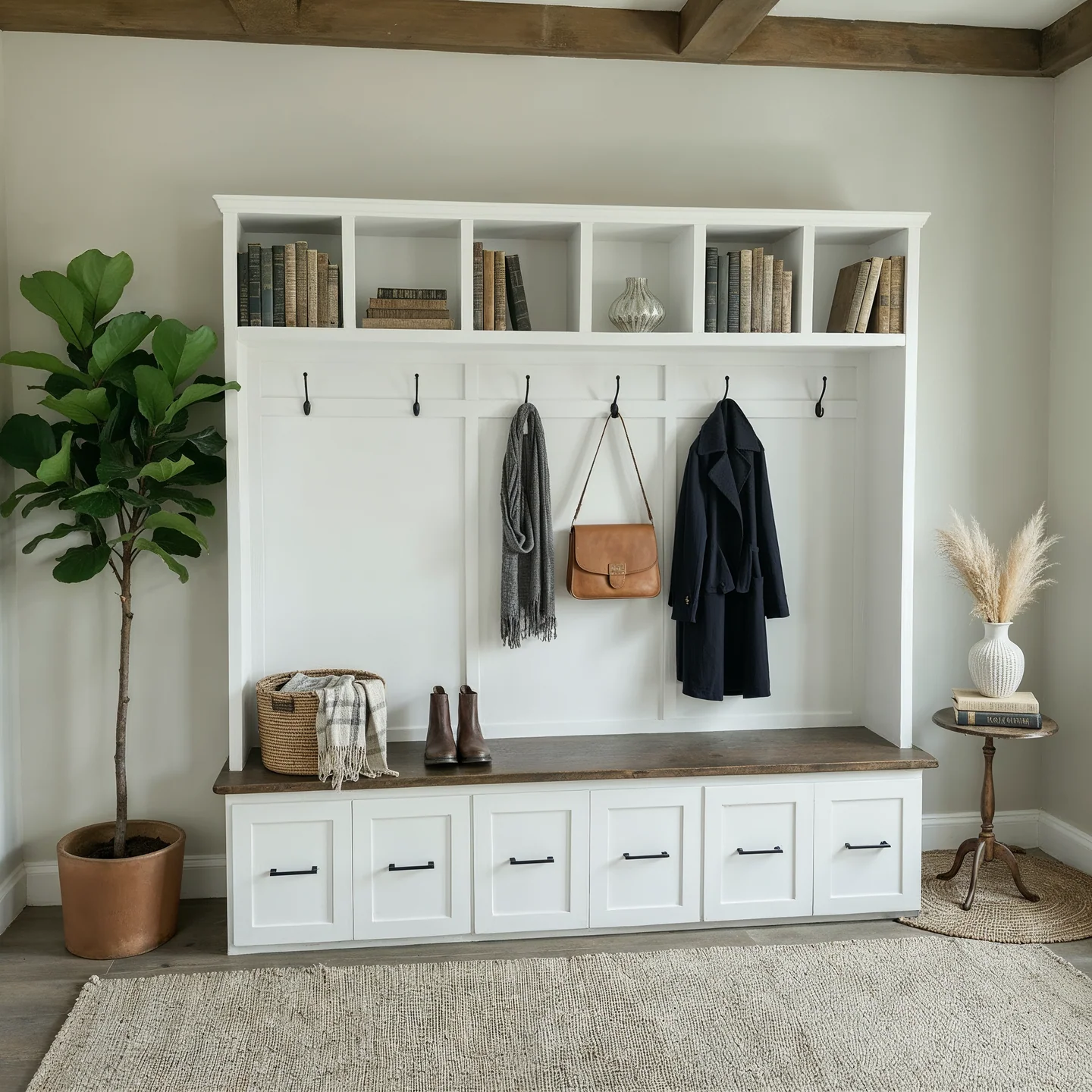 White entryway built-in bench with hooks, cubbies and reclaimed wood top