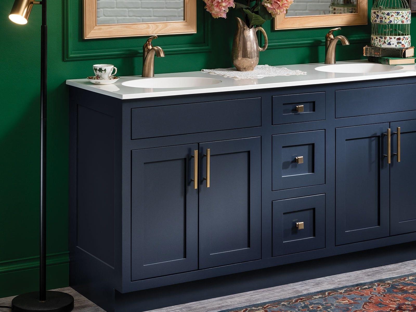 Navy shaker double vanity with brass hardware and quartz countertop