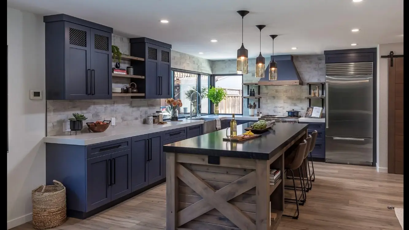 Navy shaker kitchen with rustic wood island and stone backsplash