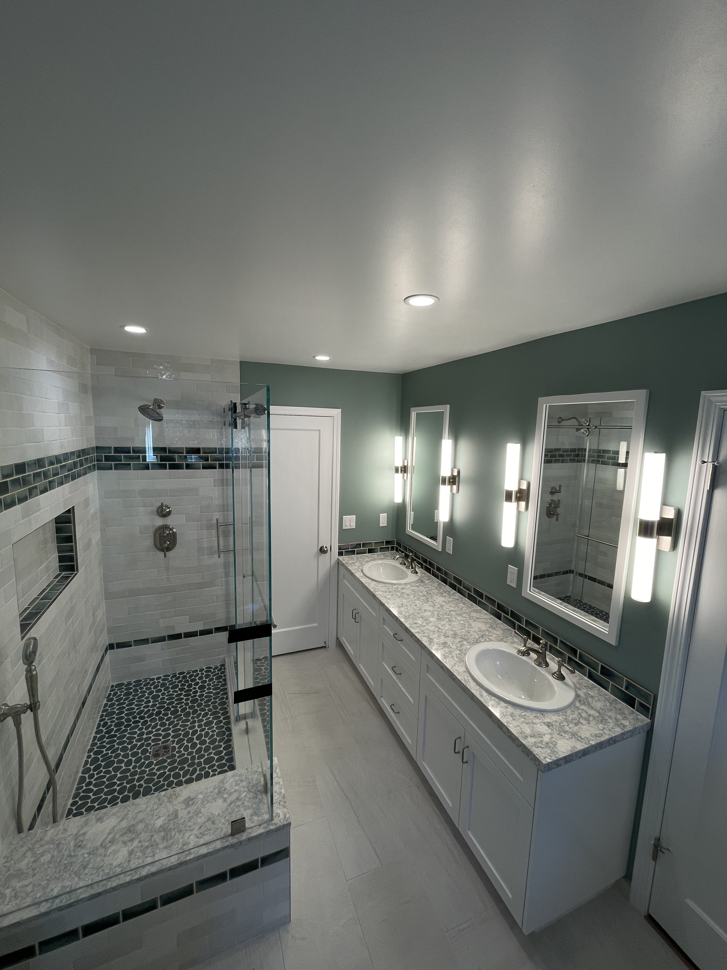 Custom bathroom remodel with tiled shower and cabinetry